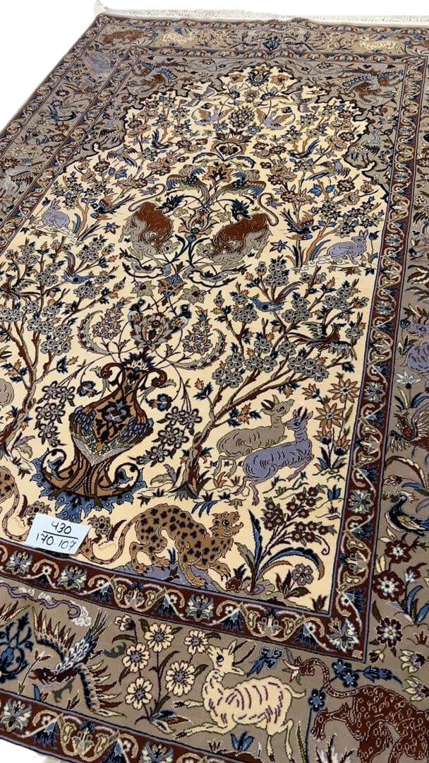 "Textured surface of antique Isfahan rug with intricate knot count"